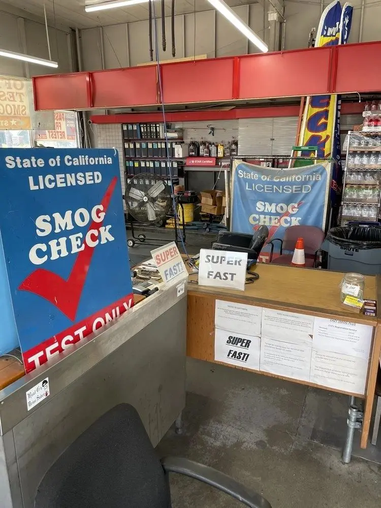 A shop with signs and papers on the counter.